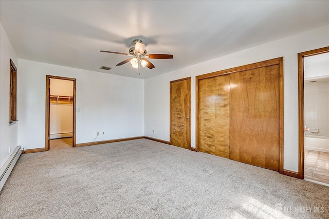 221 S Pine Ave S, South Amboy, NJ 08879 - unfurnished bedroom with baseboard heating, carpet floors, and two closets
