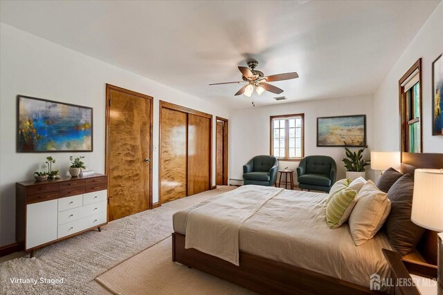 221 S Pine Ave S, South Amboy, NJ 08879 - carpeted bedroom featuring ceiling fan, baseboard heating, and multiple closets