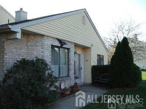 22 Victory Ct, Old Bridge, NJ 08857 - property entrance featuring a chimney