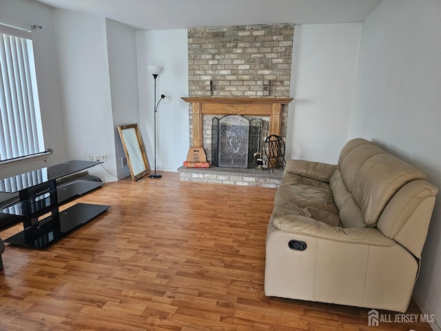 22 Victory Ct, Old Bridge, NJ 08857 - living room with wood finished floors and a brick fireplace