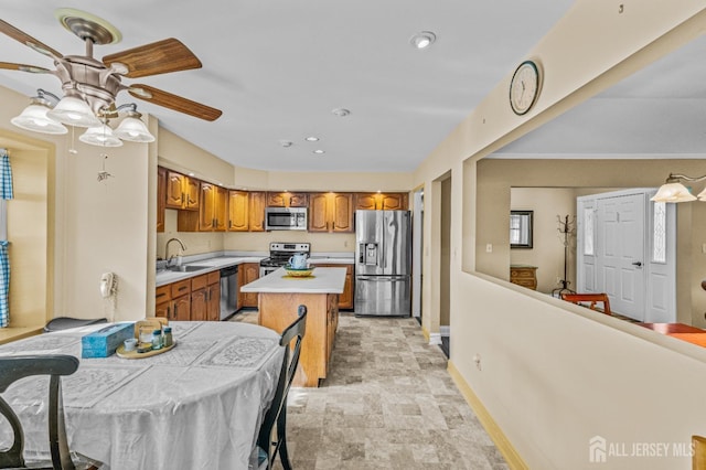 15 John Adams Ct, Monroe, NJ 08831 - kitchen featuring stainless steel appliances, ceiling fan, light countertops, stone finish flooring, and baseboards