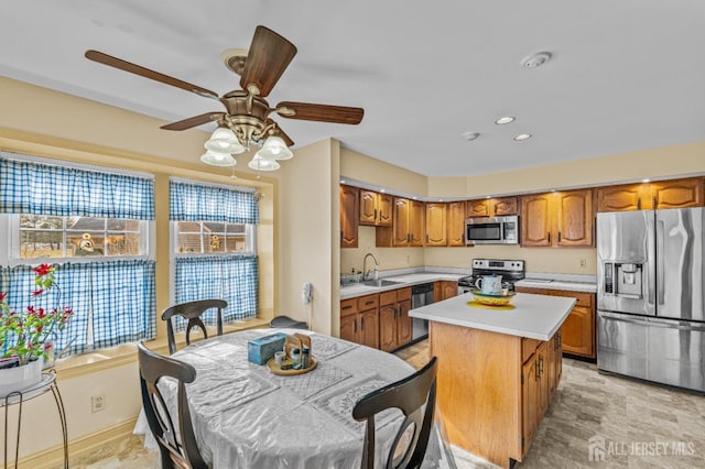 15 John Adams Ct, Monroe, NJ 08831 - kitchen with appliances with stainless steel finishes, light countertops, brown cabinetry, a sink, and recessed lighting