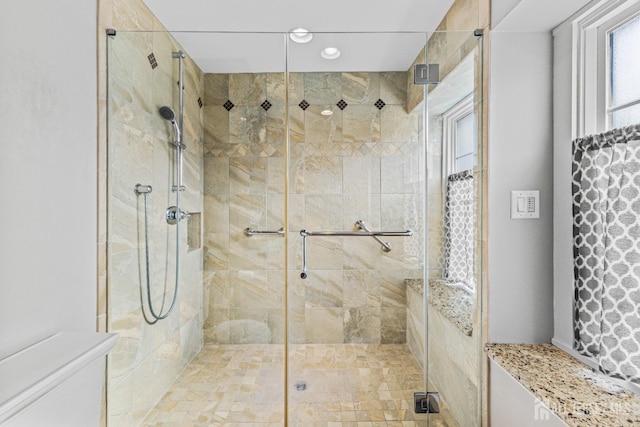 bathroom featuring a shower stall