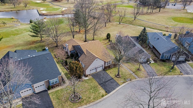 aerial view with a water view and golf course view