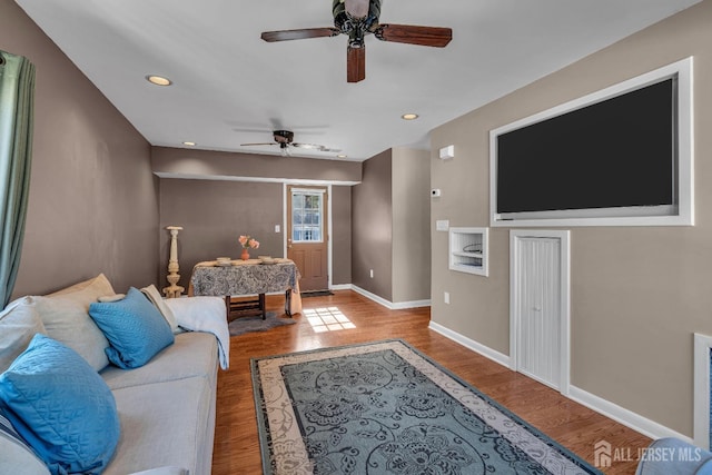 living room with recessed lighting, ceiling fan, baseboards, and wood finished floors