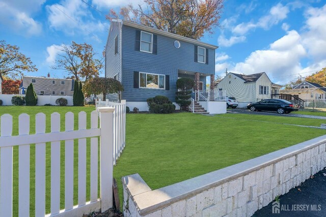 exterior space featuring a porch and a front lawn