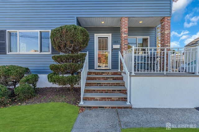 doorway to property featuring a porch