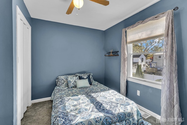 bedroom featuring visible vents, carpet, a ceiling fan, and baseboards