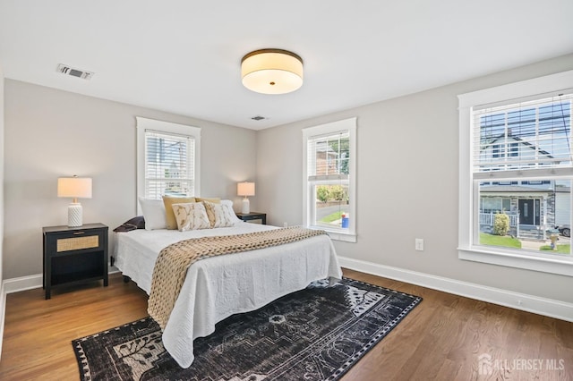 39 Embroidery St, Sayreville, NJ 08879 - bedroom featuring multiple windows and wood finished floors