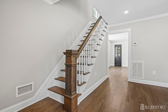 39 Embroidery St, Sayreville, NJ 08879 - staircase with crown molding, wood finished floors, and recessed lighting