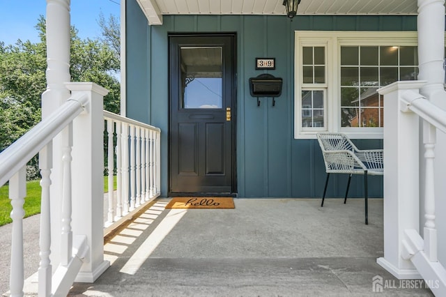 39 Embroidery St, Sayreville, NJ 08879 - property entrance featuring board and batten siding and covered porch