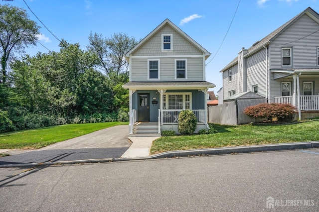 39 Embroidery St, Sayreville, NJ 08879 - american foursquare style home featuring covered porch and a front lawn