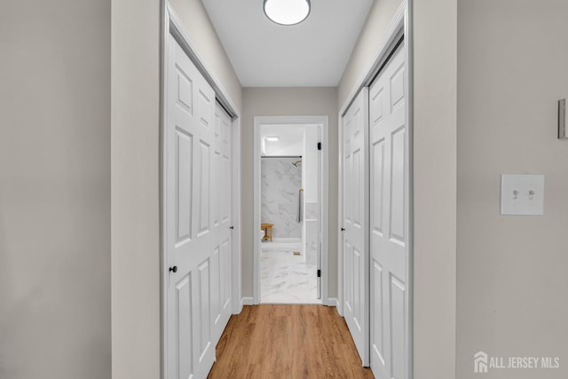 hallway featuring light wood-style flooring