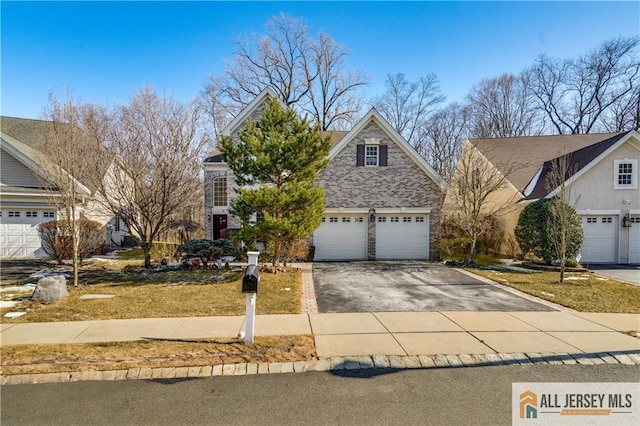 view of front of property with aphalt driveway