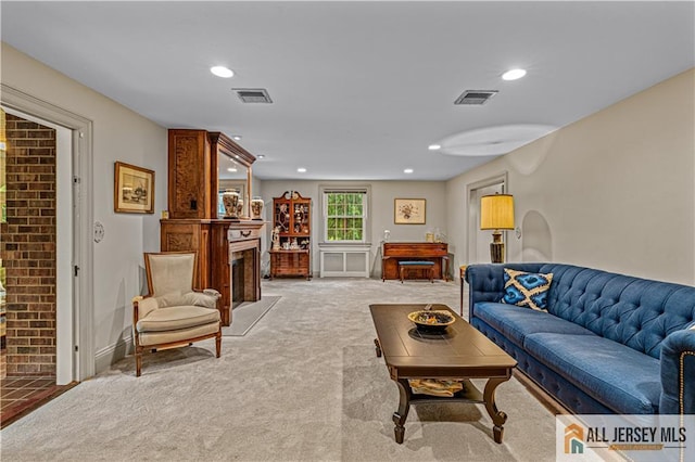57 Patton Dr, East Brunswick, NJ 08816 - living area featuring light colored carpet, a fireplace, recessed lighting, and baseboards