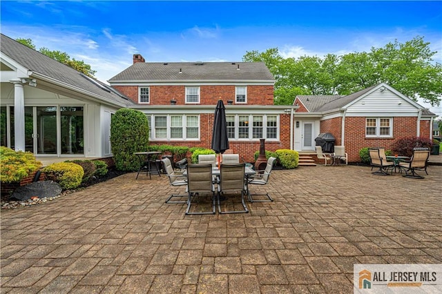 57 Patton Dr, East Brunswick, NJ 08816 - view of patio / terrace with outdoor dining space, a grill, and entry steps