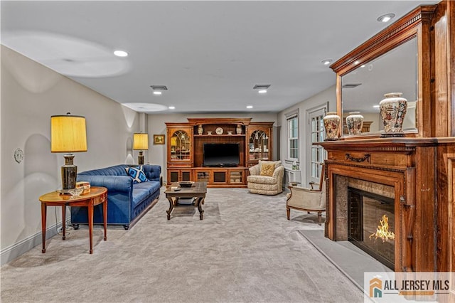 57 Patton Dr, East Brunswick, NJ 08816 - carpeted living area with a glass covered fireplace, recessed lighting, and baseboards
