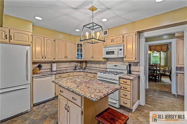 57 Patton Dr, East Brunswick, NJ 08816 - kitchen featuring white appliances, a chandelier, a kitchen island, stone finish flooring, and a sink
