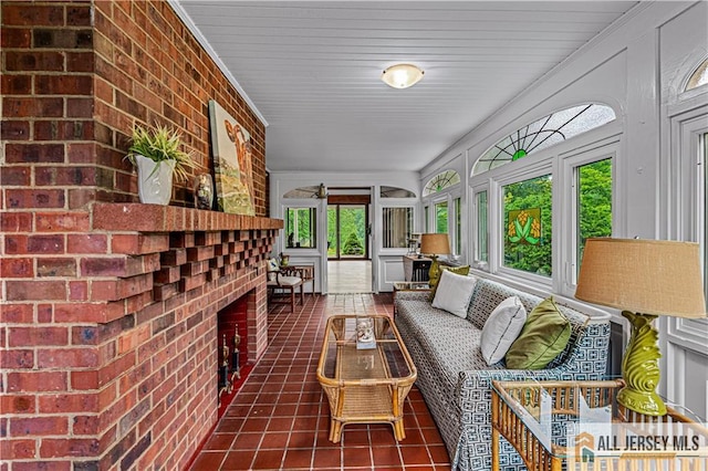 57 Patton Dr, East Brunswick, NJ 08816 - sunroom / solarium featuring tile patterned floors, plenty of natural light, and brick wall