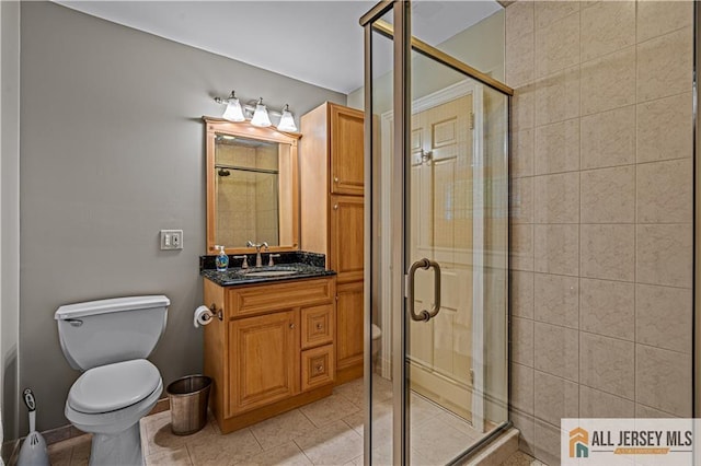 57 Patton Dr, East Brunswick, NJ 08816 - bathroom featuring toilet, a shower stall, vanity, and tile patterned flooring