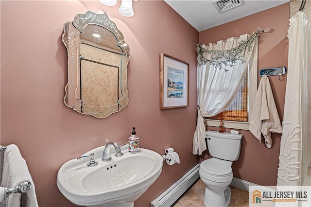57 Patton Dr, East Brunswick, NJ 08816 - bathroom with baseboard heating, a sink, toilet, baseboards, and tile patterned flooring