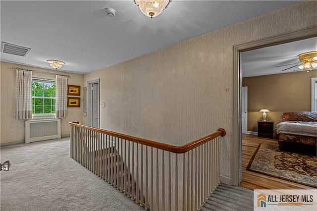 57 Patton Dr, East Brunswick, NJ 08816 - hall featuring an upstairs landing, carpet, and radiator