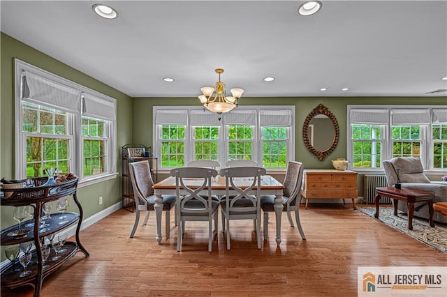 57 Patton Dr, East Brunswick, NJ 08816 - dining area with a chandelier, radiator, recessed lighting, light wood-type flooring, and baseboards