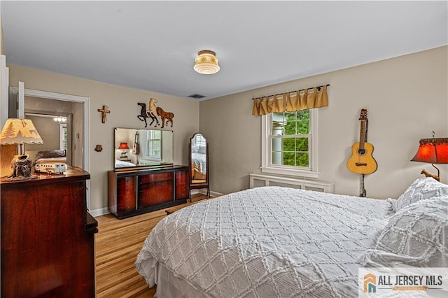 57 Patton Dr, East Brunswick, NJ 08816 - bedroom with wood finished floors and baseboards