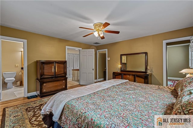 57 Patton Dr, East Brunswick, NJ 08816 - bedroom with wood finished floors, baseboards, a ceiling fan, and ensuite bath