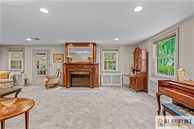 57 Patton Dr, East Brunswick, NJ 08816 - carpeted living area with a fireplace with flush hearth and recessed lighting