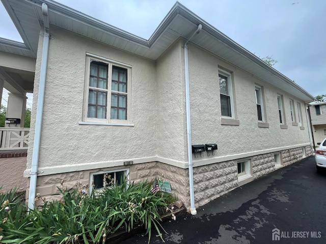 309 S 2nd Ave S, Highland Park, NJ 08904 - view of side of property featuring stucco siding