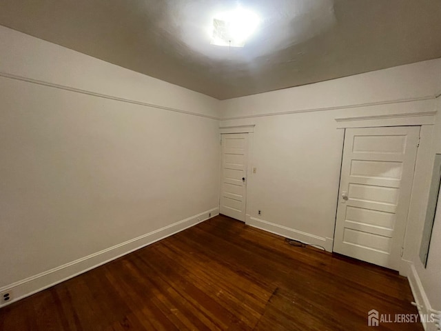 309 S 2nd Ave S, Highland Park, NJ 08904 - spare room featuring dark wood-style floors and baseboards