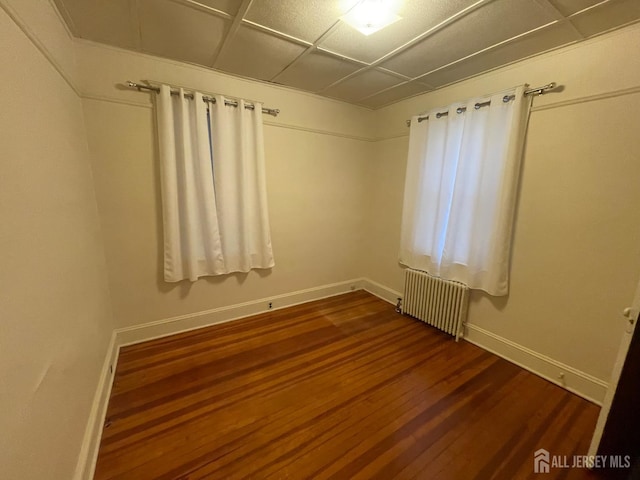 309 S 2nd Ave S, Highland Park, NJ 08904 - spare room featuring radiator heating unit, dark wood finished floors, and baseboards