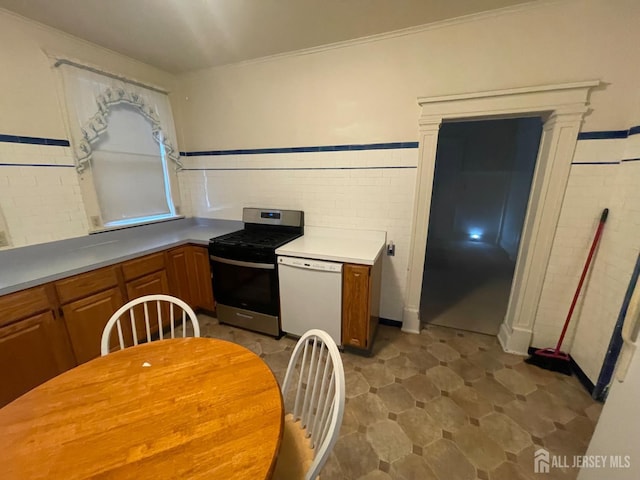 309 S 2nd Ave S, Highland Park, NJ 08904 - kitchen featuring stainless steel gas stove, dishwasher, brown cabinets, and light countertops