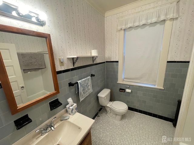 309 S 2nd Ave S, Highland Park, NJ 08904 - half bathroom featuring tile walls, wallpapered walls, tile patterned floors, a wainscoted wall, and toilet