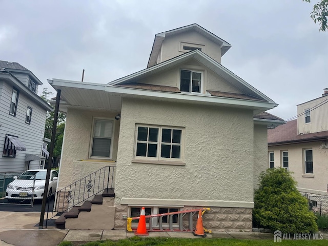 309 S 2nd Ave S, Highland Park, NJ 08904 - view of front of house featuring stucco siding