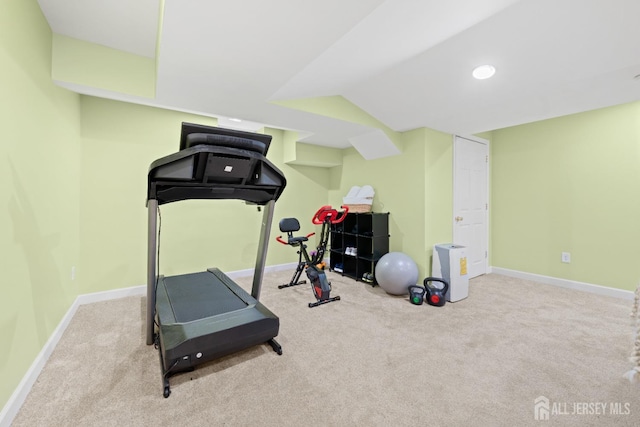 workout area with baseboards and carpet flooring