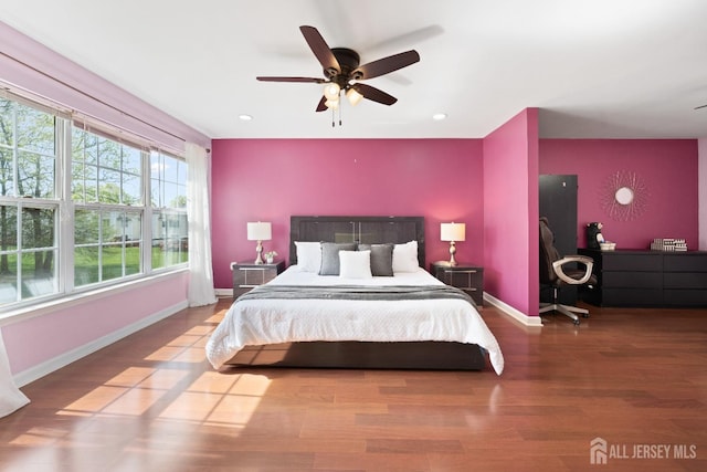 bedroom with baseboards, ceiling fan, recessed lighting, and wood finished floors
