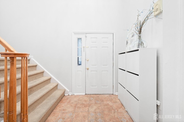 entryway featuring stairs