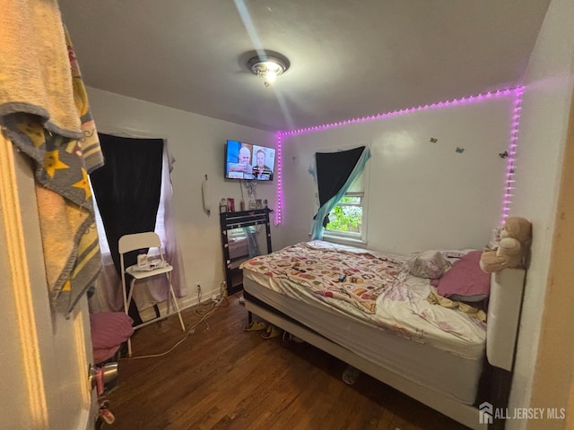 166 Fulton St, New Brunswick, NJ 08901 - bedroom with wood finished floors