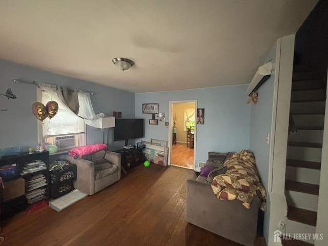 166 Fulton St, New Brunswick, NJ 08901 - living area with wood finished floors and cooling unit