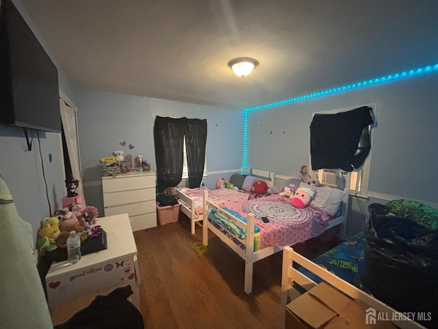 166 Fulton St, New Brunswick, NJ 08901 - bedroom featuring dark wood finished floors