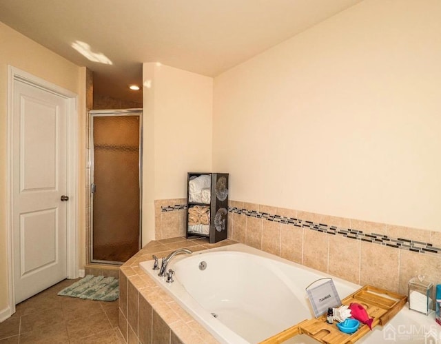 bathroom with tile patterned floors and separate shower and tub