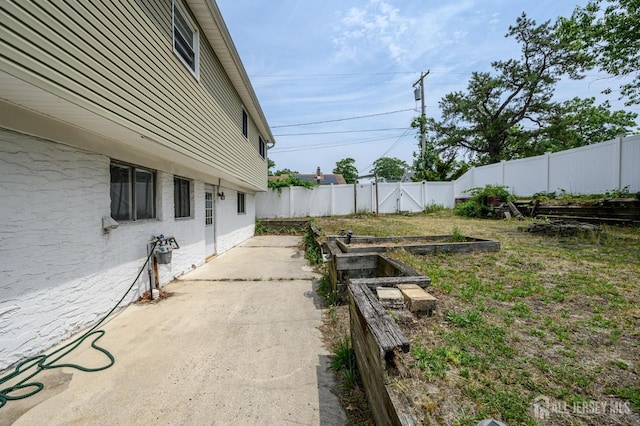 701 Beach Ave, Beachwood, NJ 08722 - fenced backyard with a garden and a patio