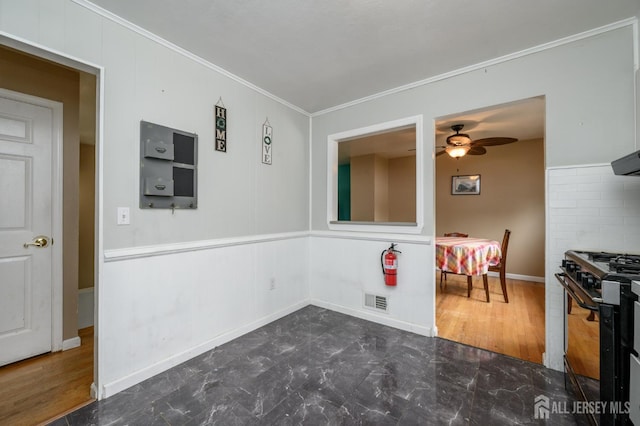 701 Beach Ave, Beachwood, NJ 08722 - dining room featuring ornamental molding, a ceiling fan, and wood finished floors