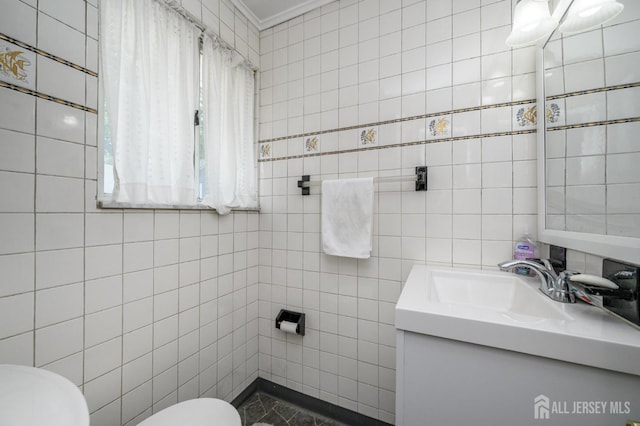 701 Beach Ave, Beachwood, NJ 08722 - half bathroom featuring tile walls, vanity, and ornamental molding
