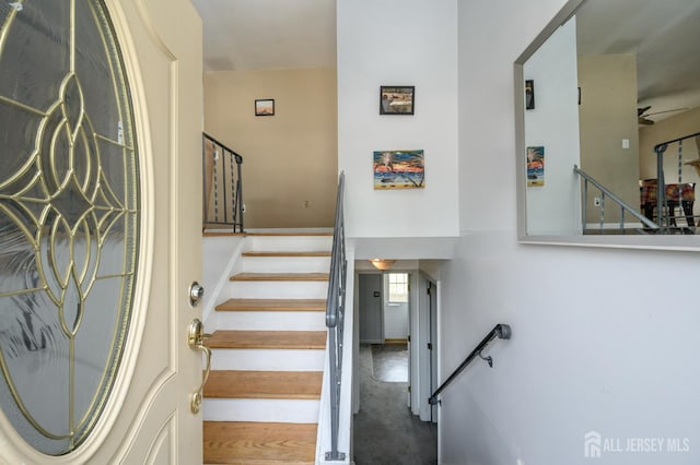 701 Beach Ave, Beachwood, NJ 08722 - stairway with a ceiling fan and concrete flooring