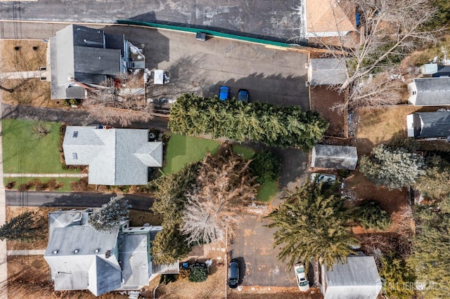 birds eye view of property with a residential view