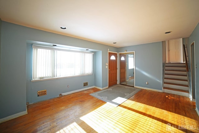 entrance foyer featuring wood-type flooring