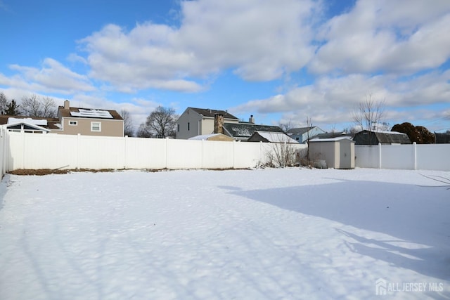 view of yard layered in snow